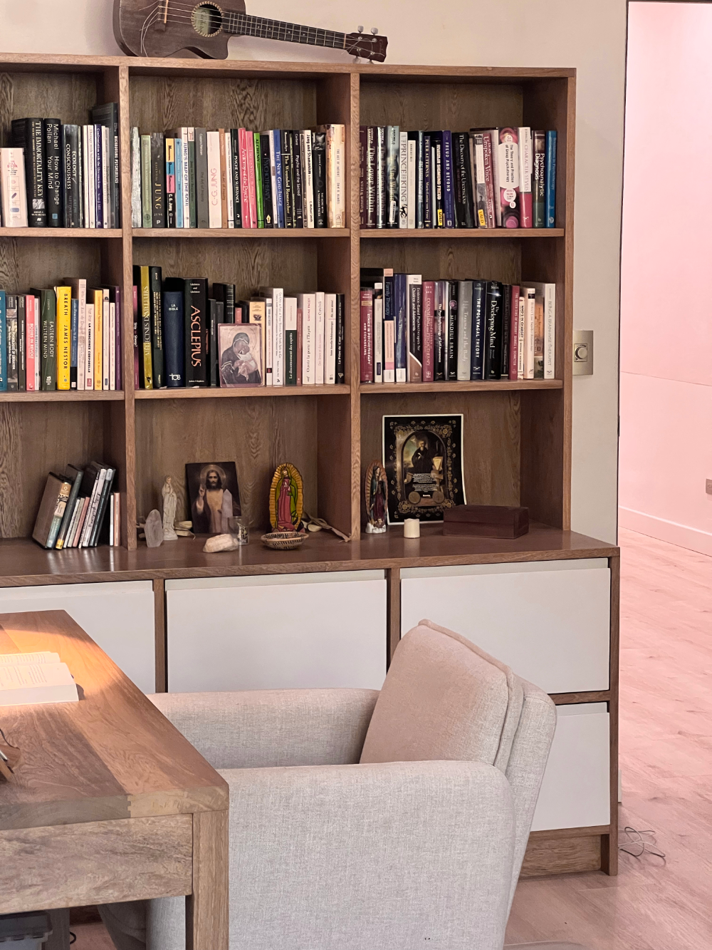 Bookshelf full of depth psychology books in Bernard Becker Ph.D.'s music therapy session space, music psychotherapist in Nosara.